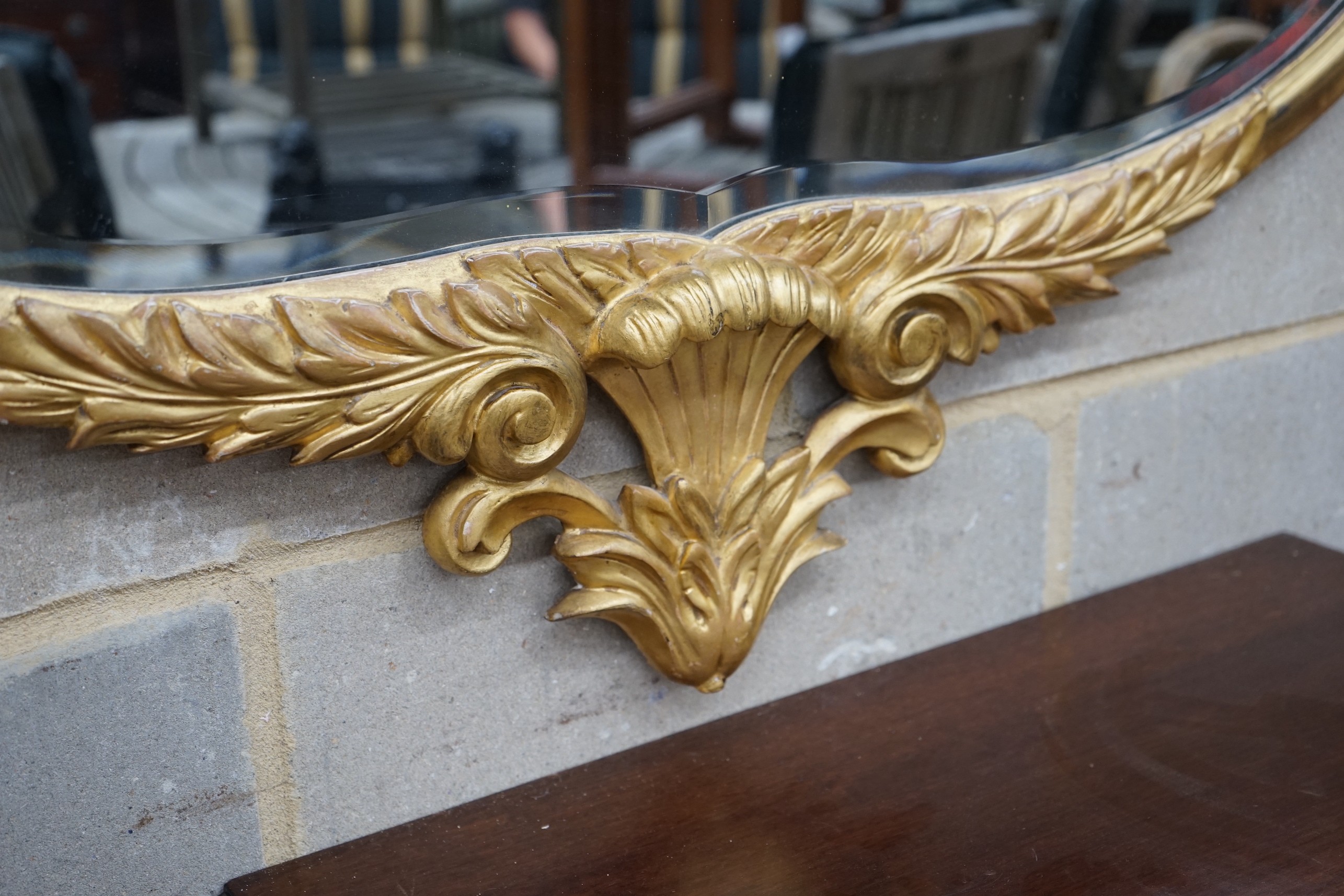 A large carved late Victorian gilt framed wall mirror, width 112cm, height 115cm